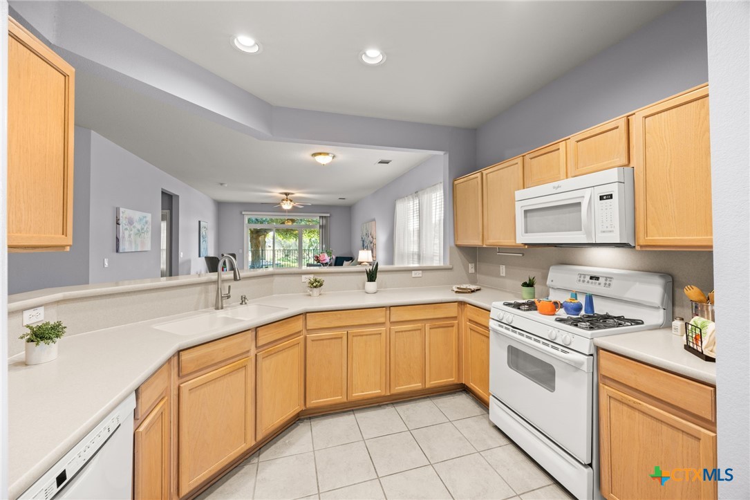 303 Bonham Loop Georgetown, TX 78633 - Photo 2 of 12 Kitchen gas range microwave and dishwasher