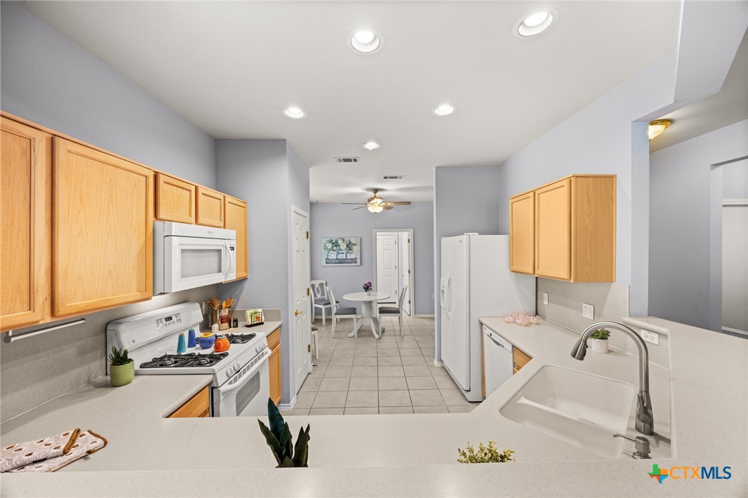 303 Bonham Loop Georgetown, TX 78633 - Photo 3 of 12 Kitchen refrigerator conveys, gas range open to eat in Kitchen