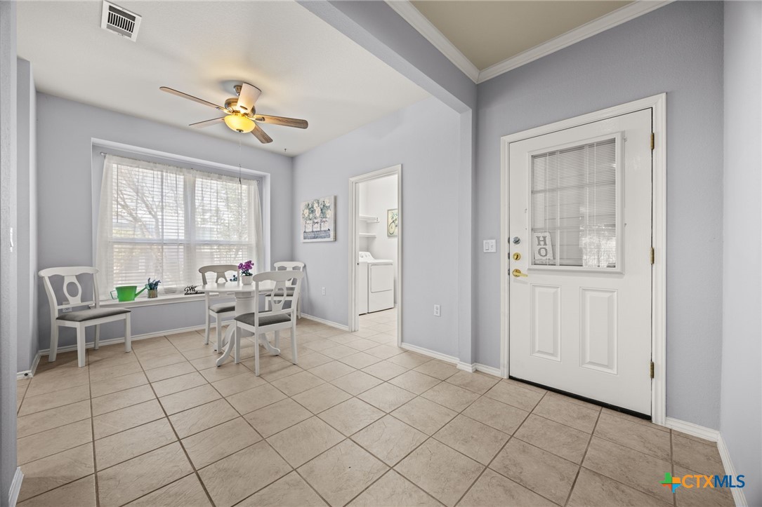 303 Bonham Loop Georgetown, TX 78633 - Photo 4 of 12 Eat in Kitchen off Laundry room w ceiling fan and lots of light