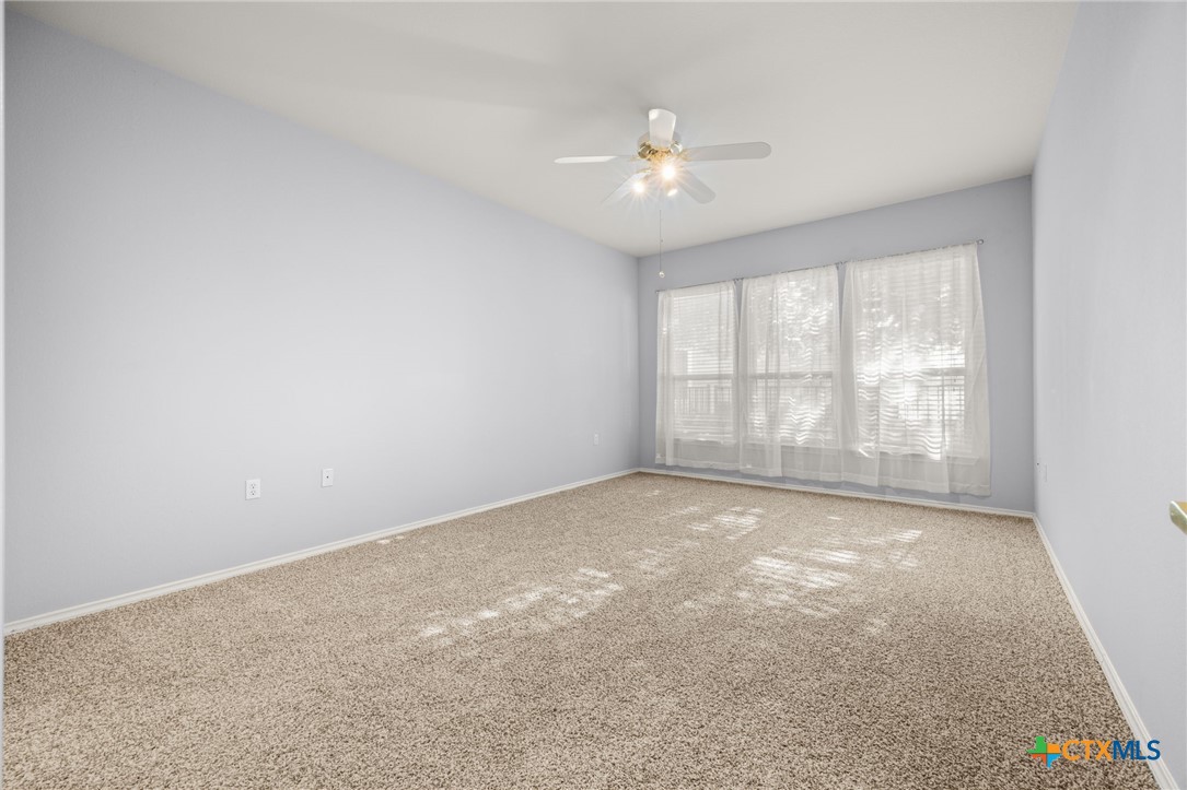 303 Bonham Loop Georgetown, TX 78633 - Photo 7 of 12 Master bedroom with Ceiling Fan