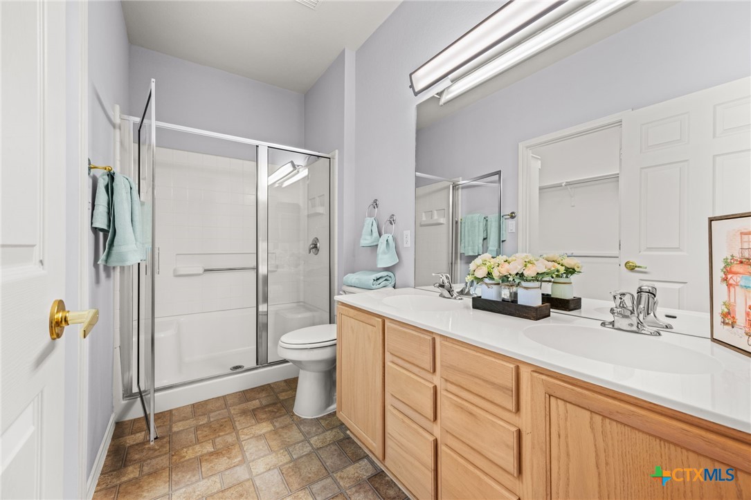 303 Bonham Loop Georgetown, TX 78633 - Photo 8 of 12 Master Bathroom with Walk in Shower and Dual Vanities
