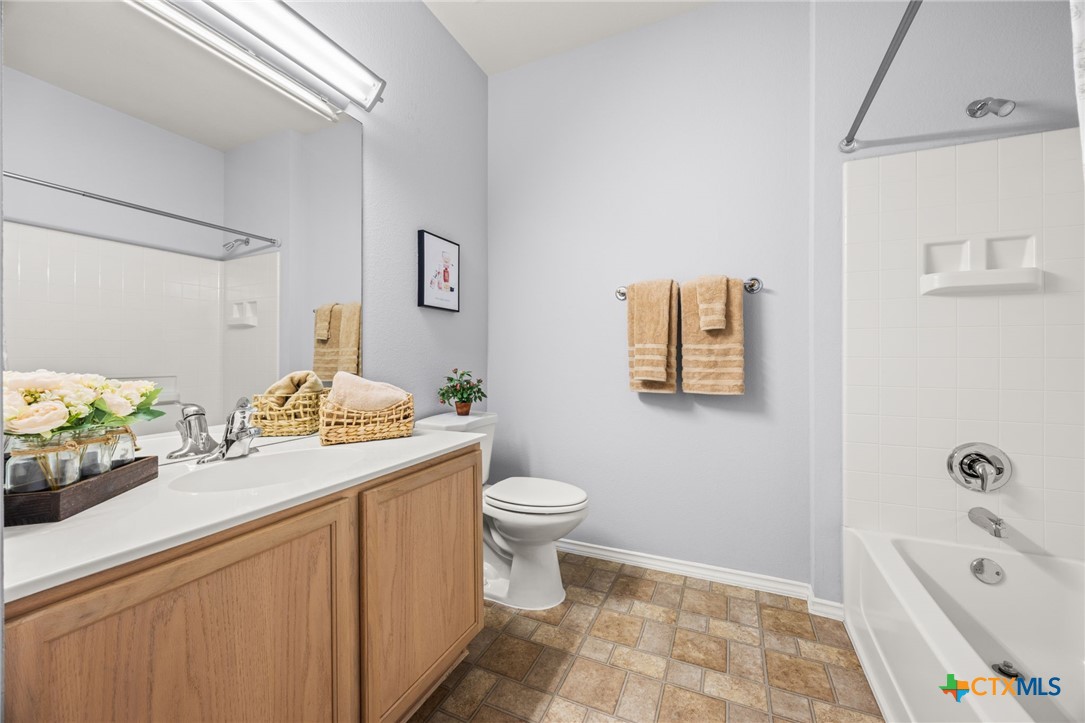 303 Bonham Loop Georgetown, TX 78633 - Photo 10 of 12 Second Bathroom with shower and tub combination