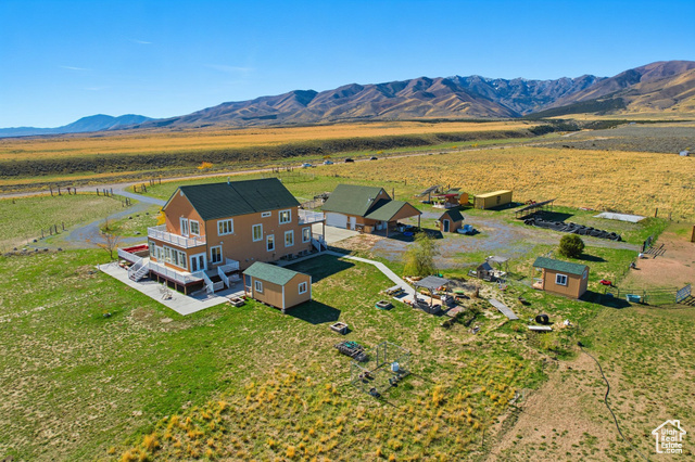 4768 East Hickman Canyon Road Stockton, UT 84071 - Photo 66 of 85 Overview of home and landscape with a mountainous background.