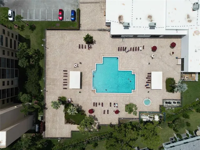 an aerial view of a residential house with yard