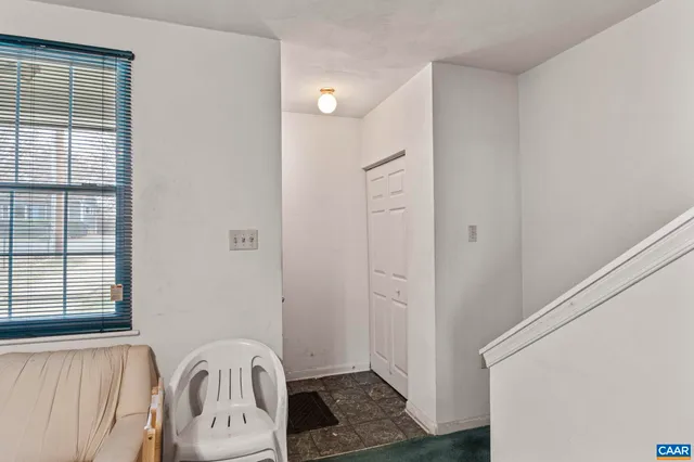 a view of a brick house with many windows