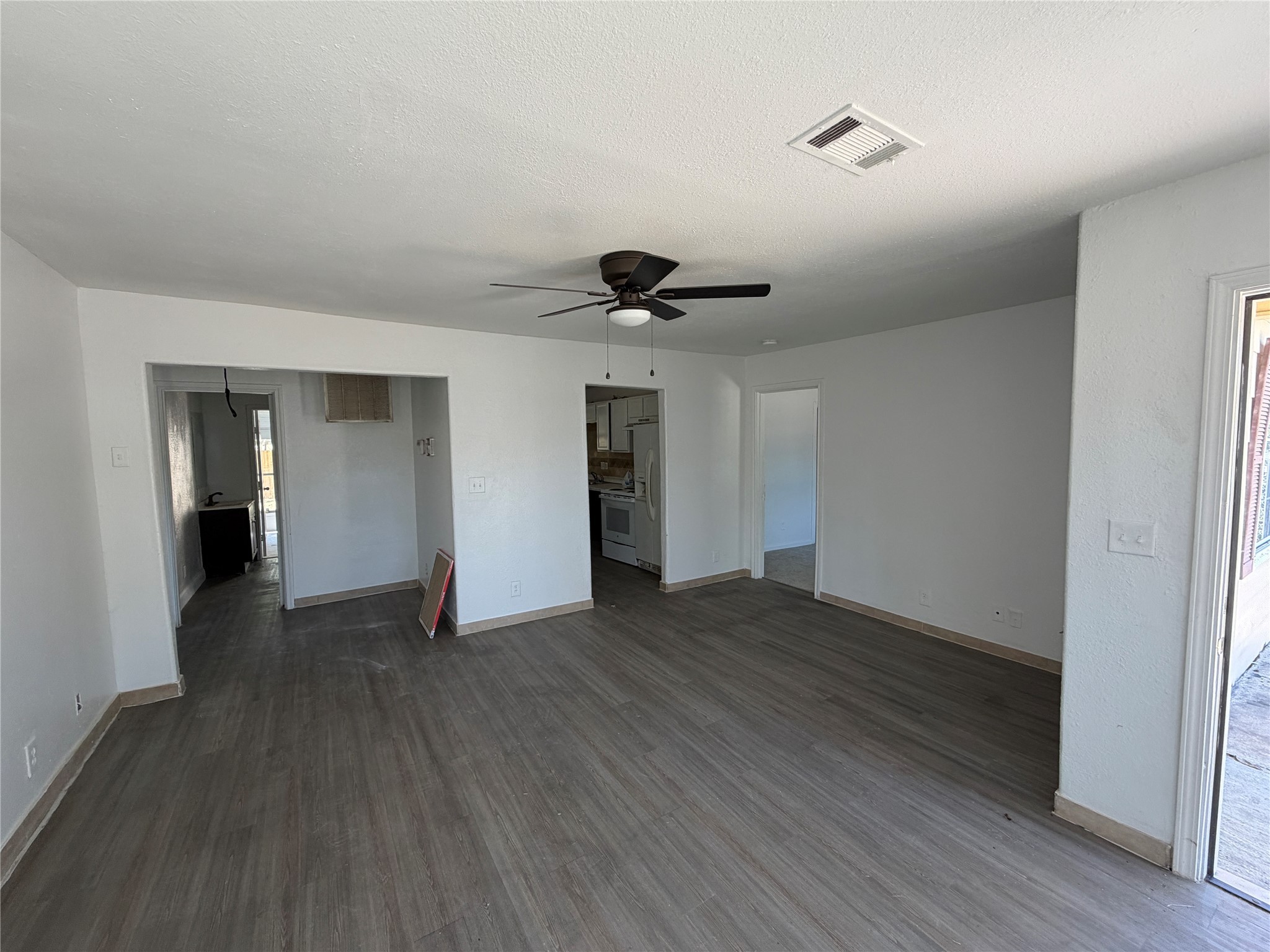 7606 Darnay Drive Houston, TX 77033 - Photo 5 of 11 a view of an empty room with wooden floor
