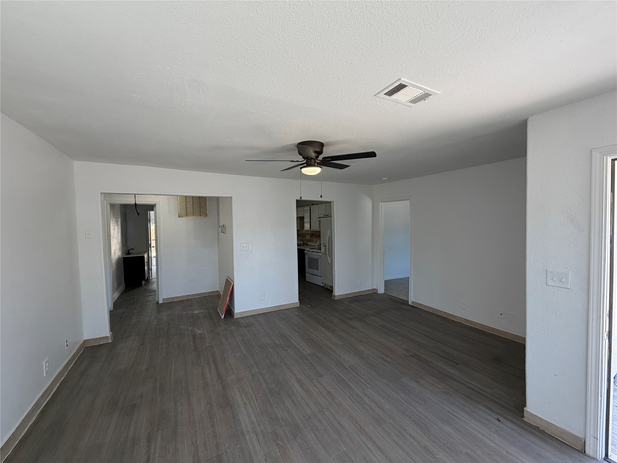 7606 Darnay Drive Houston, TX 77033 - Photo 6 of 11 a view of an empty room with wooden floor