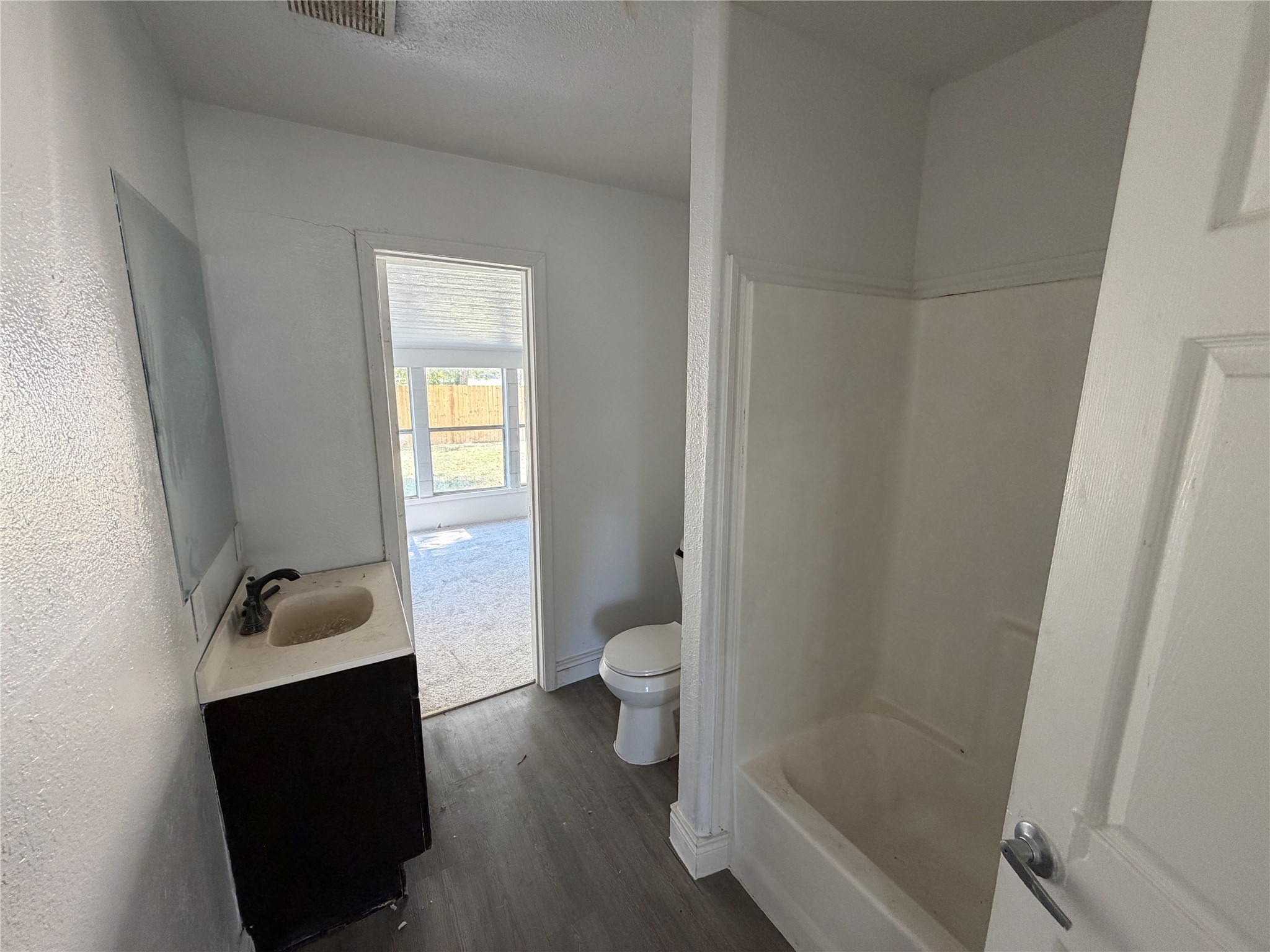 7606 Darnay Drive Houston, TX 77033 - Photo 10 of 11 a bathroom with a sink and a toilet