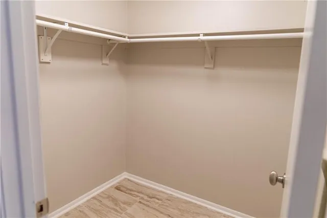 a view of an empty walk in closet