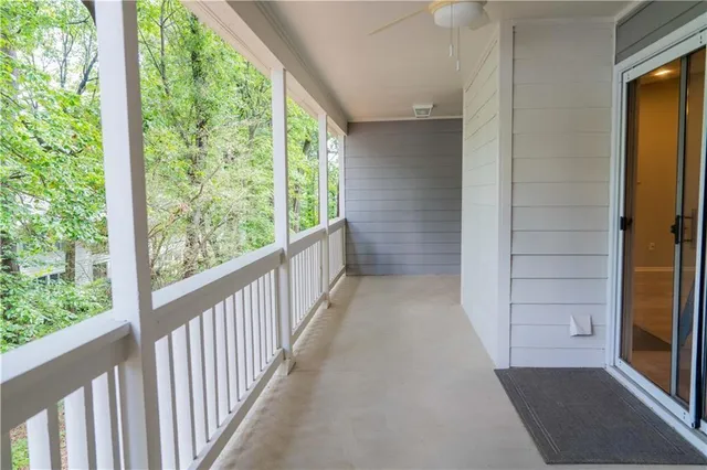 a view of a balcony with wooden floor