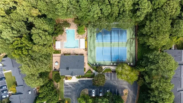 an aerial view of a house with garden space and street view
