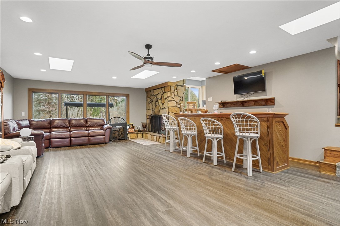 2765 Fixler Road Medina, OH 44256 - Photo 12 of 33 Living room featuring ceiling fan, and a skyligh