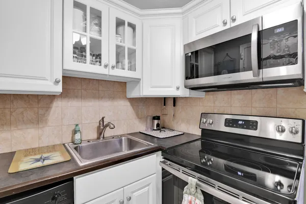a kitchen with a sink and cabinets