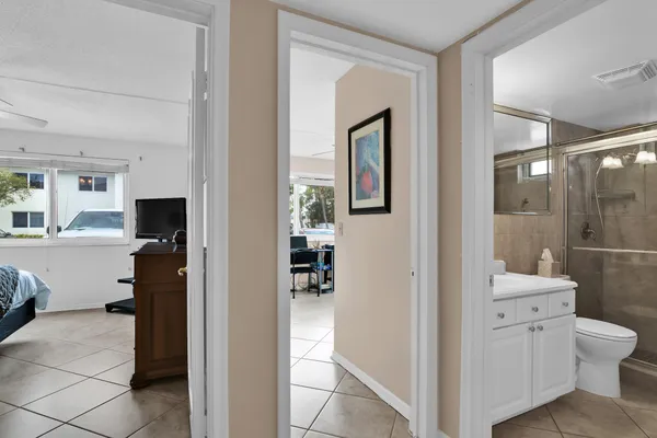 a bathroom with a toilet sink and shower