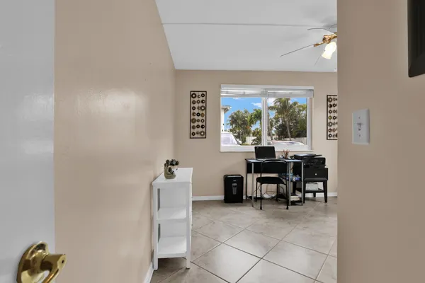 a dining room with furniture and a window
