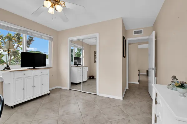 a view of a livingroom with furniture cabinet and flat screen tv