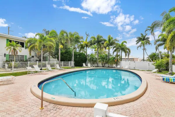 a view of a swimming pool with a patio