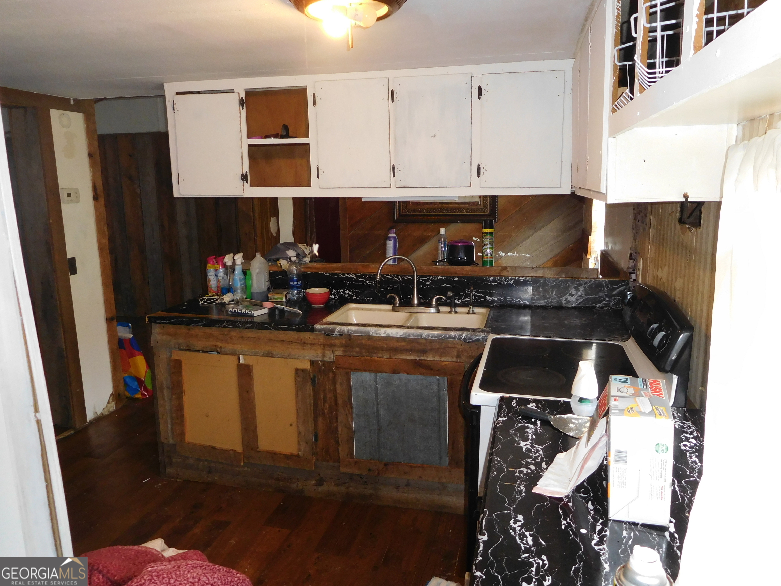 142 Ellis Road Southeast Rome, GA 30161 - Photo 11 of 21 a kitchen with stainless steel appliances a stove a microwave and a refrigerator