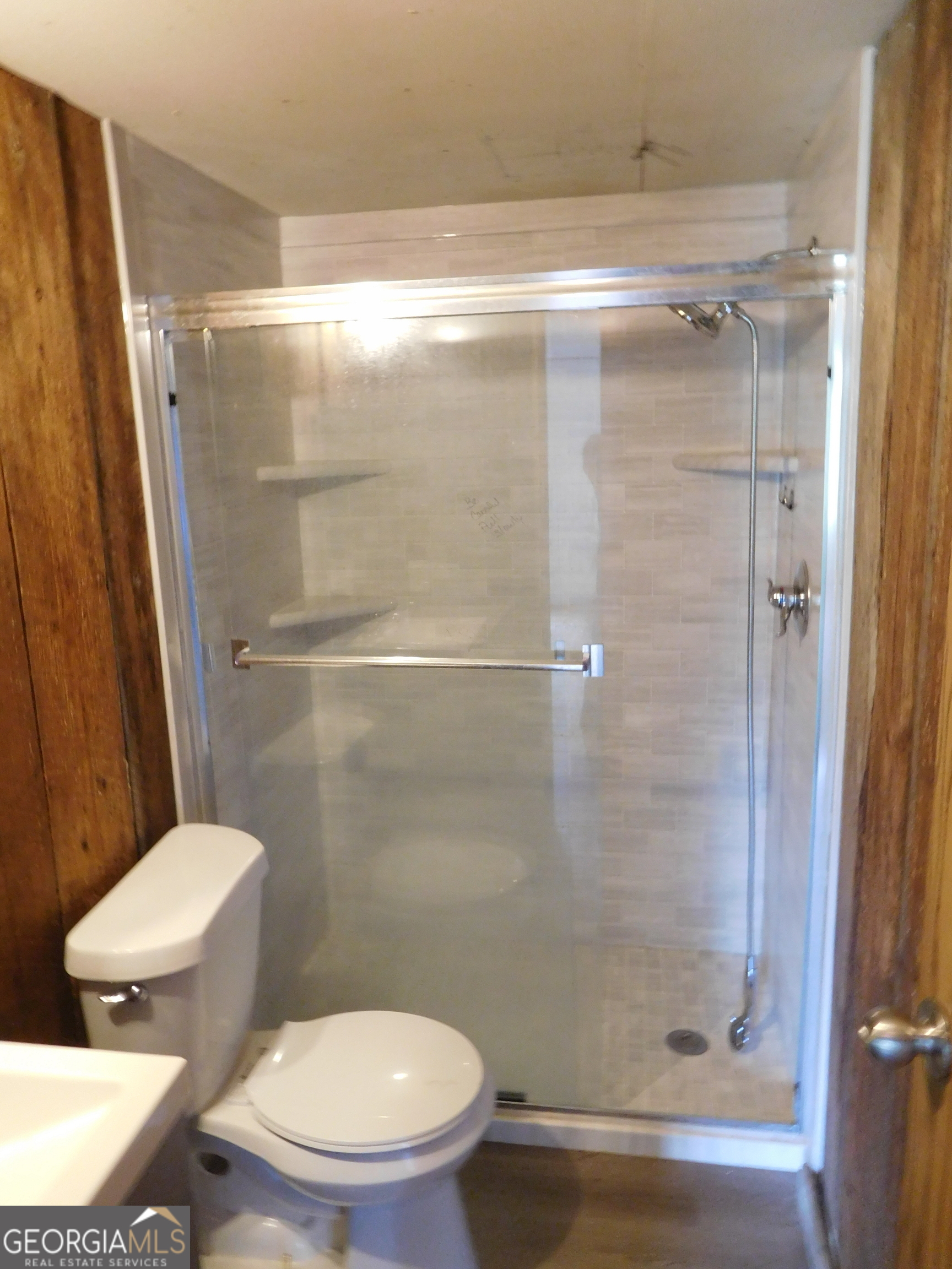 142 Ellis Road Southeast Rome, GA 30161 - Photo 20 of 21 a white toilet next to a bathroom