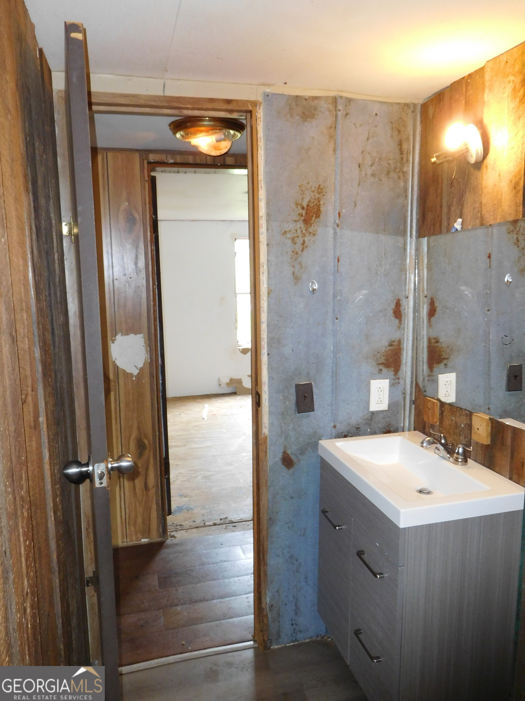 142 Ellis Road Southeast Rome, GA 30161 - Photo 21 of 21 a bathroom with a sink a mirror and a shower