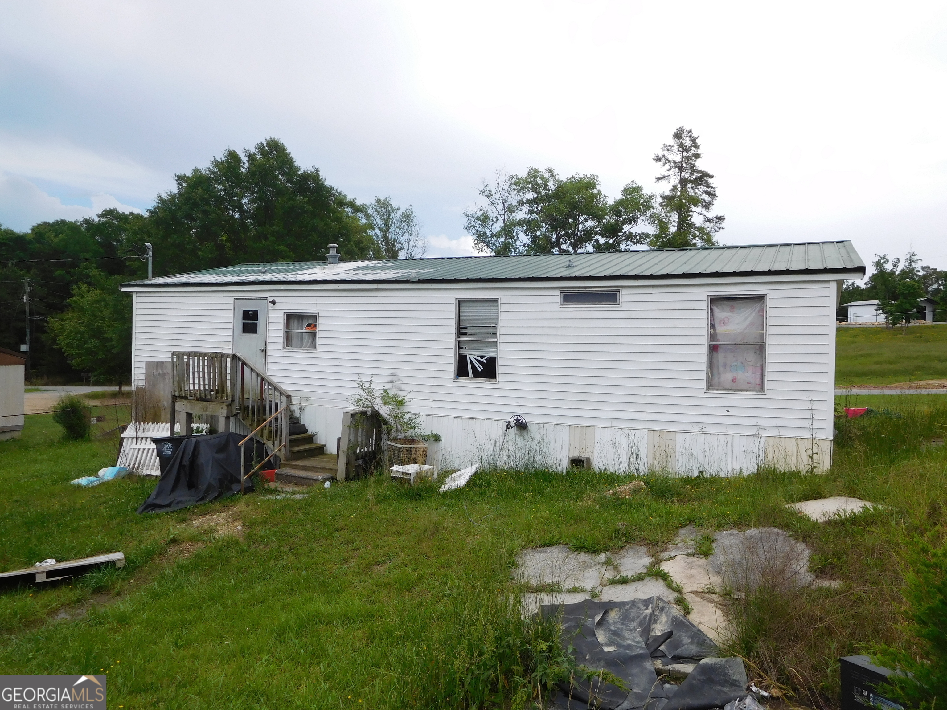 142 Ellis Road Southeast Rome, GA 30161 - Photo 6 of 21 a view of a house with backyard