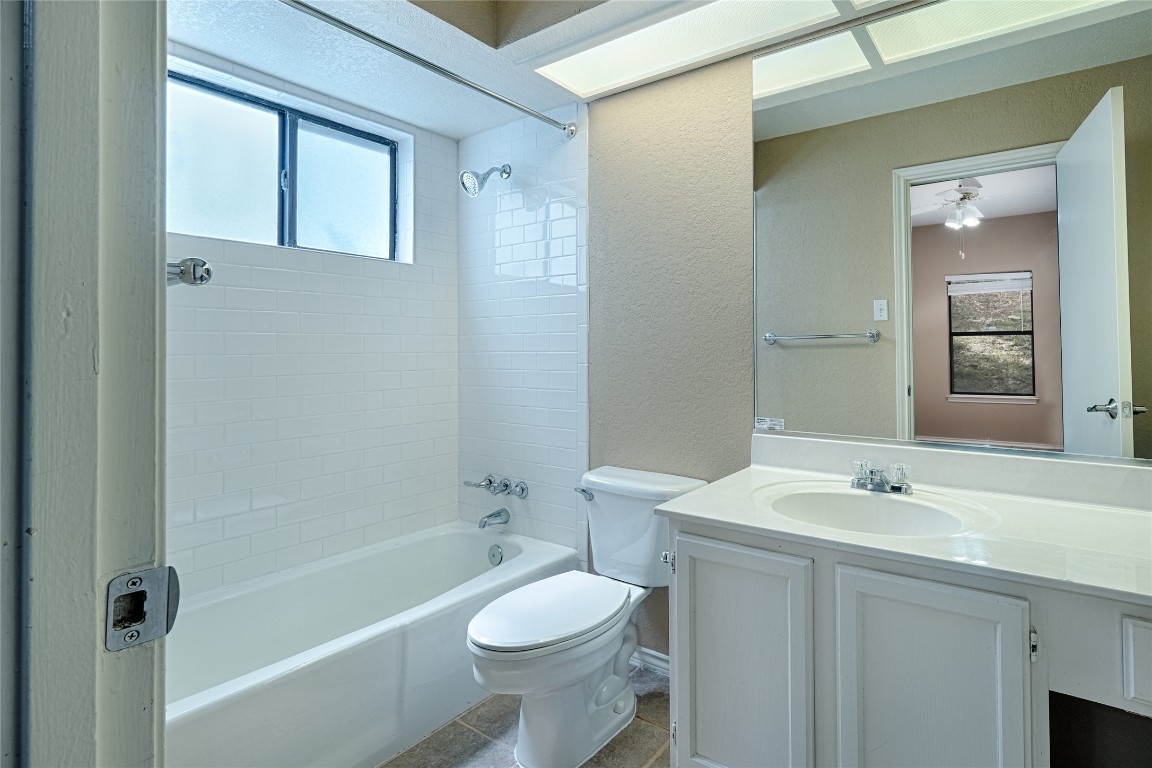4711 Spicewood Springs Road, Unit 173 Austin, TX 78759 - Photo 14 of 19 a bathroom with a sink toilet and shower