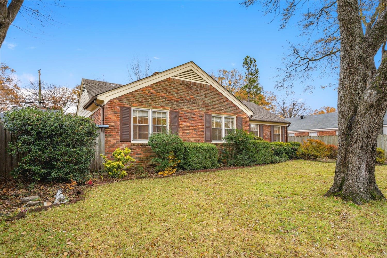 1072 Ivy Road Memphis, TN 38117 - Photo 2 of 35 a front view of a house with garden