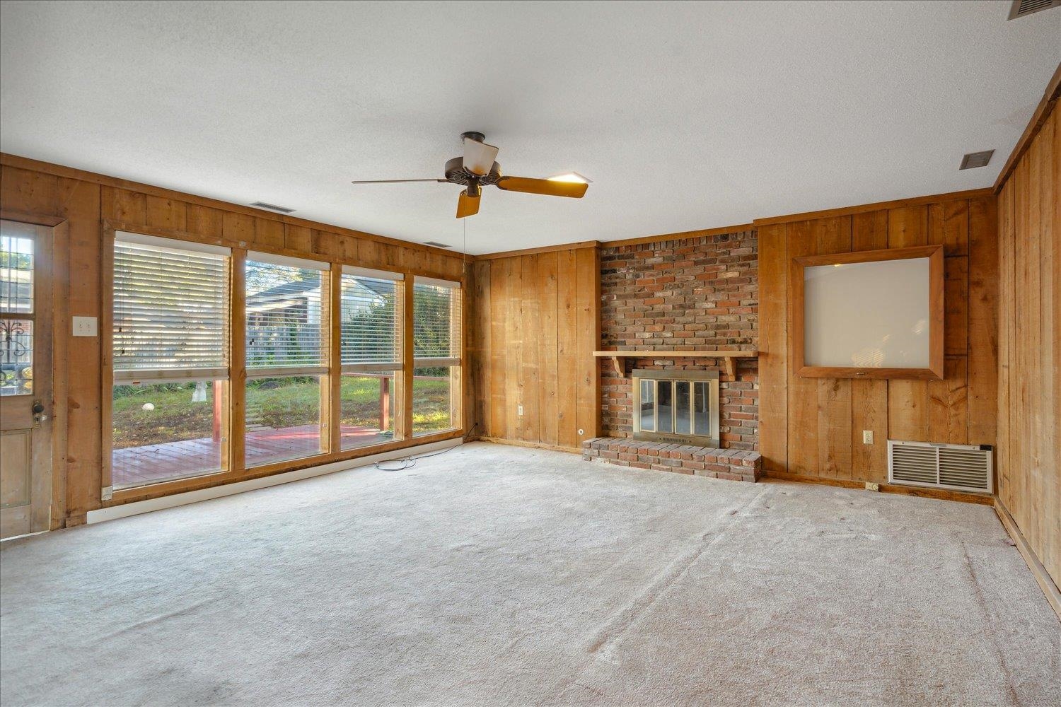 1072 Ivy Road Memphis, TN 38117 - Photo 25 of 35 a view of an empty room with a fireplace and a window