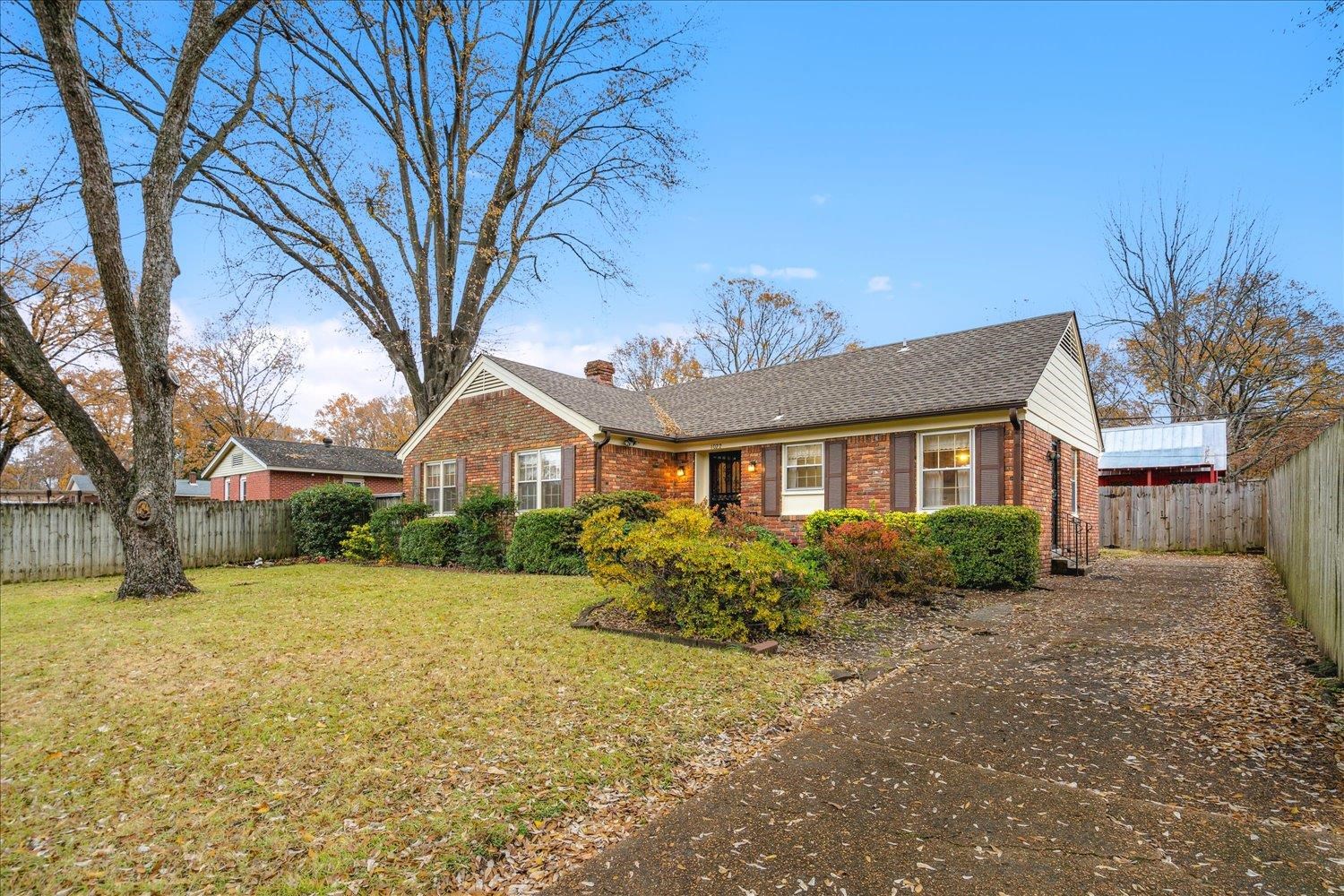 1072 Ivy Road Memphis, TN 38117 - Photo 3 of 35 a front view of house with yard and green space