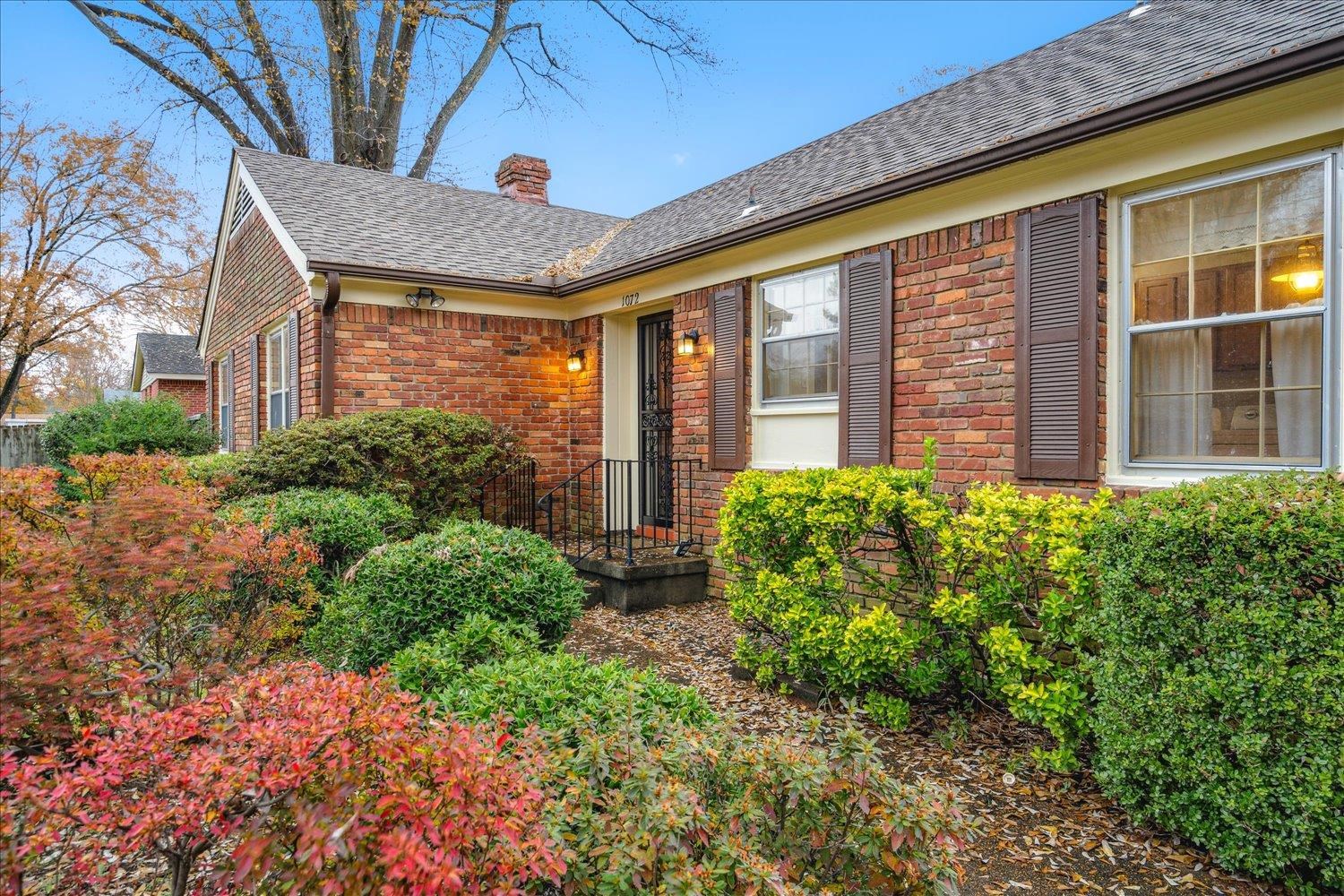 1072 Ivy Road Memphis, TN 38117 - Photo 5 of 35 a front view of a house with garden