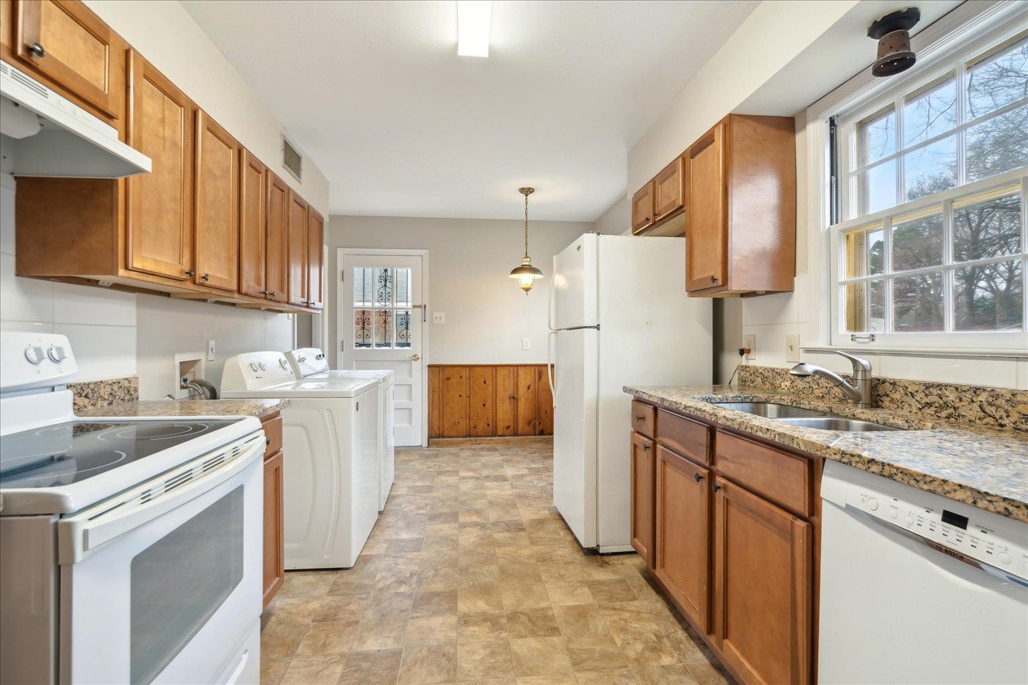 1072 Ivy Road Memphis, TN 38117 - Photo 8 of 35 a kitchen with a sink stove and cabinets