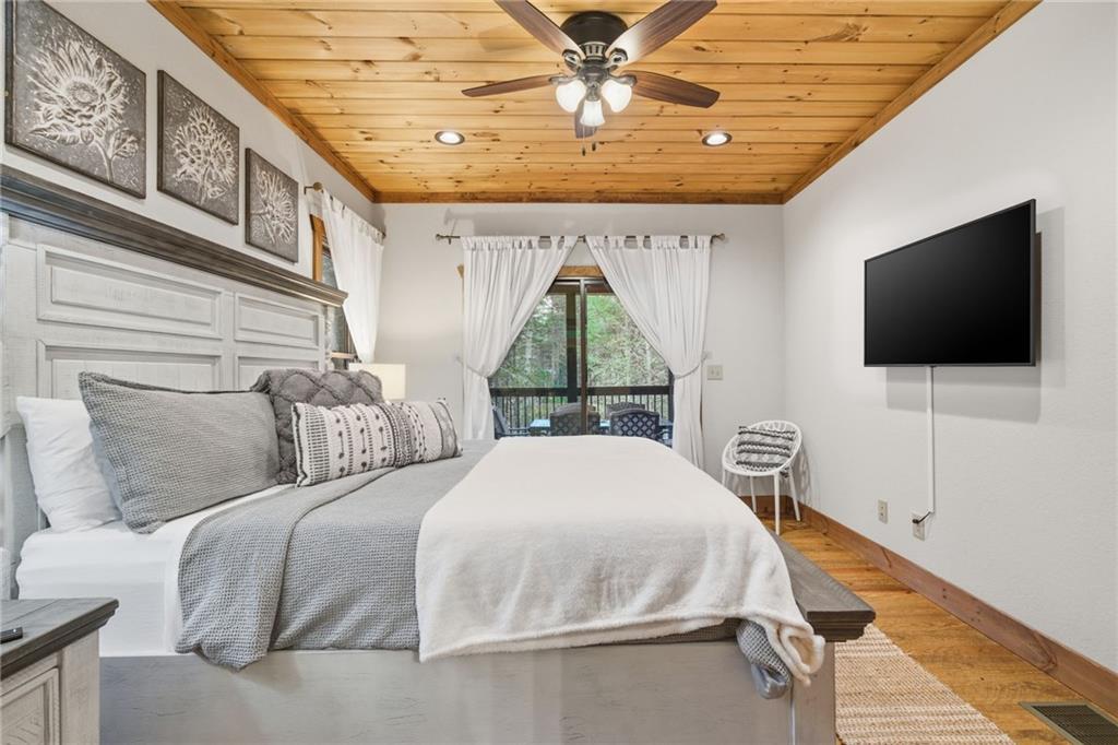 41 Bunks Way Morganton, GA 30560 - Photo 15 of 33 a bedroom with a bed and a flat screen tv