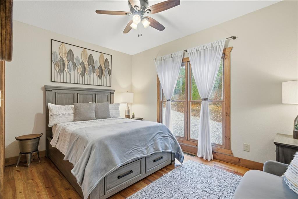 41 Bunks Way Morganton, GA 30560 - Photo 18 of 33 a bedroom with a bed painting on wall and a large window