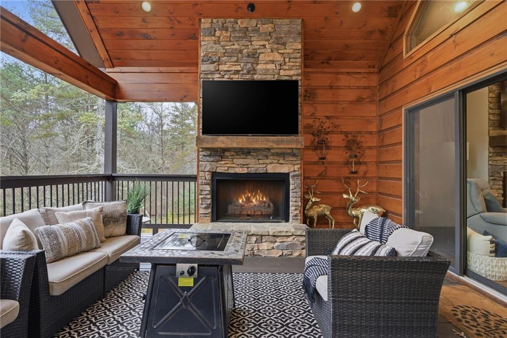 41 Bunks Way Morganton, GA 30560 - Photo 25 of 33 a living room with furniture a fireplace and a flat screen tv