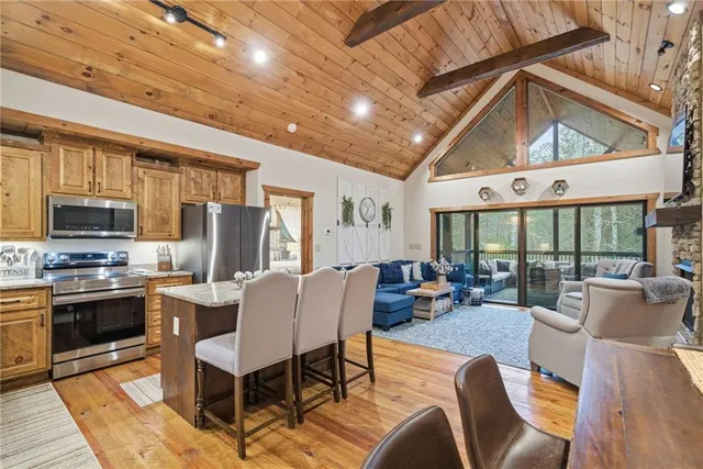 a living room with fireplace furniture and a flat screen tv