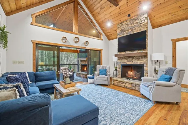 a living room with furniture fireplace and a flat screen tv