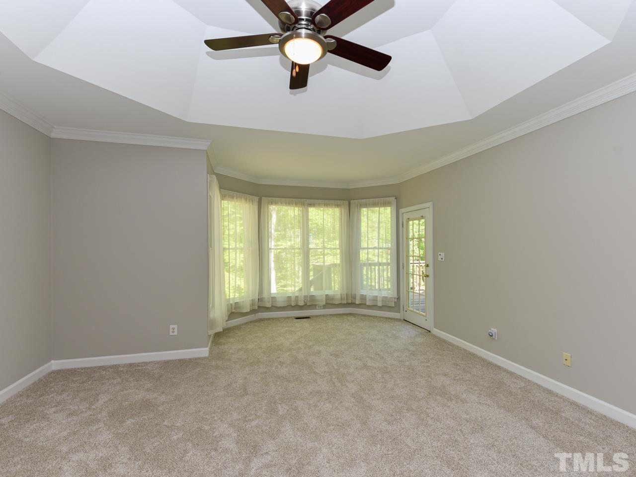 5820 Orchid Valley Road Raleigh, NC 27613 - Photo 18 of 31 a view of an empty room with a window