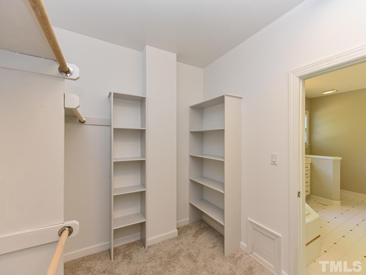 5820 Orchid Valley Road Raleigh, NC 27613 - Photo 21 of 31 a view of walk in closet with empty racks