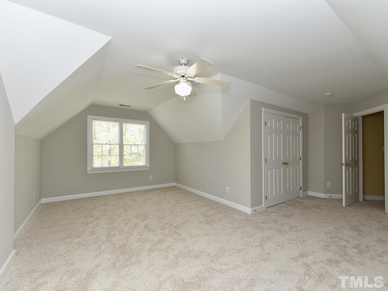 5820 Orchid Valley Road Raleigh, NC 27613 - Photo 22 of 31 a view of an empty room with a window