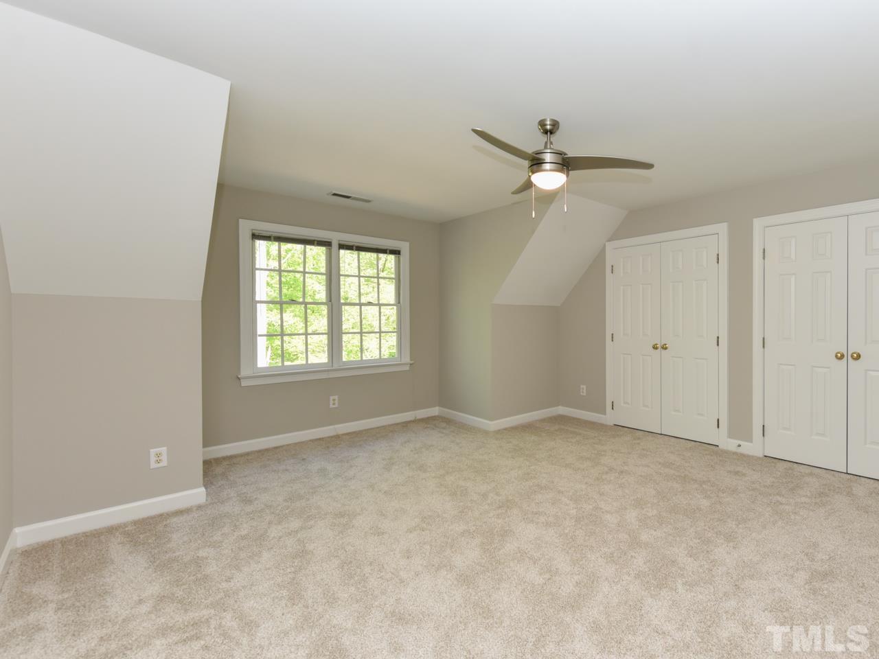 5820 Orchid Valley Road Raleigh, NC 27613 - Photo 23 of 31 a view of an empty room with a window