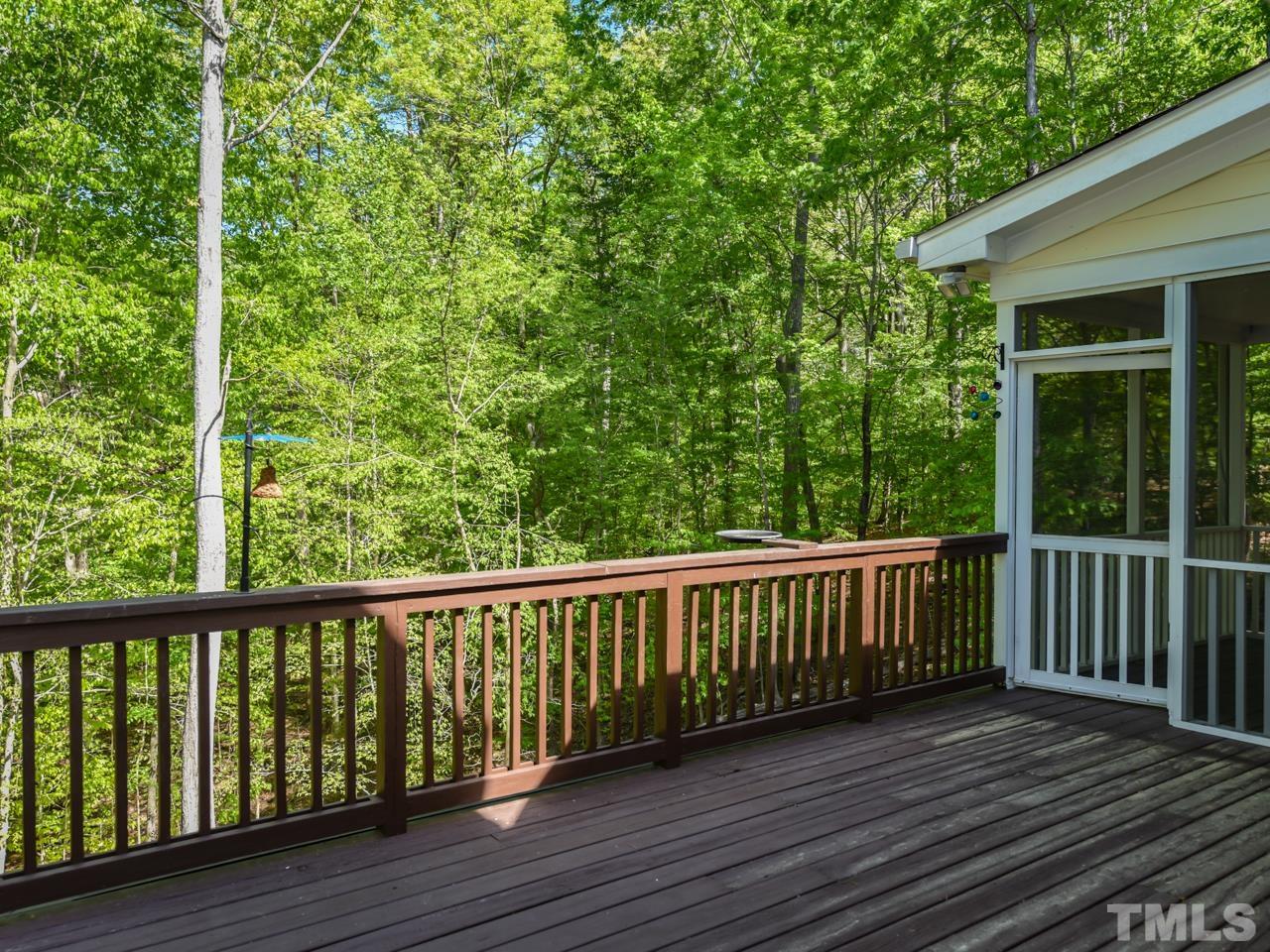 5820 Orchid Valley Road Raleigh, NC 27613 - Photo 26 of 31 a view of a wooden roof deck
