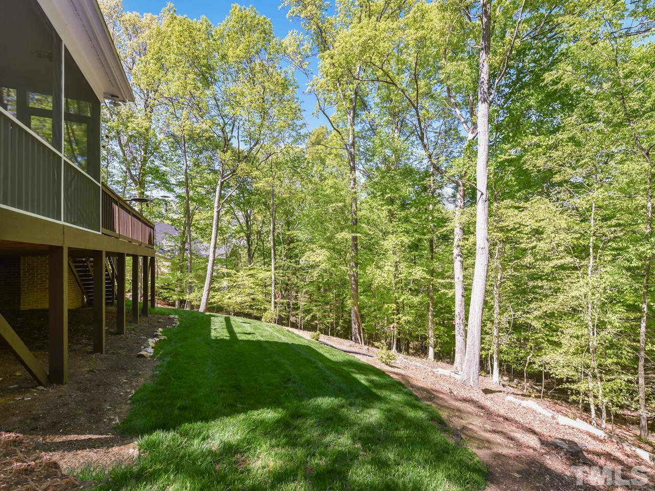 5820 Orchid Valley Road Raleigh, NC 27613 - Photo 27 of 31 a view of a backyard with pathway