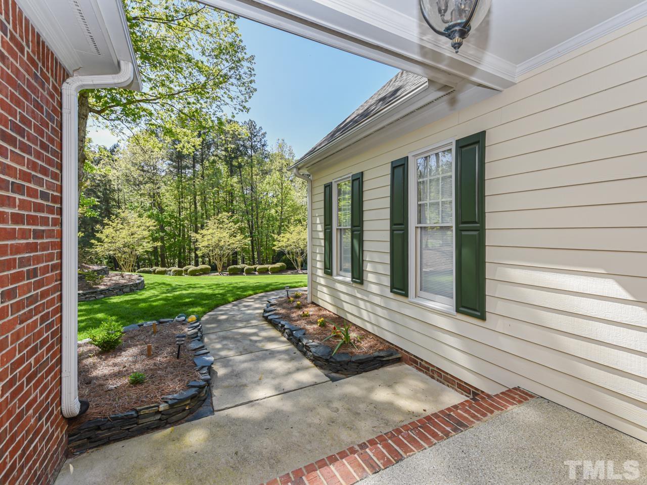5820 Orchid Valley Road Raleigh, NC 27613 - Photo 4 of 31 a view of a entrance door of the house