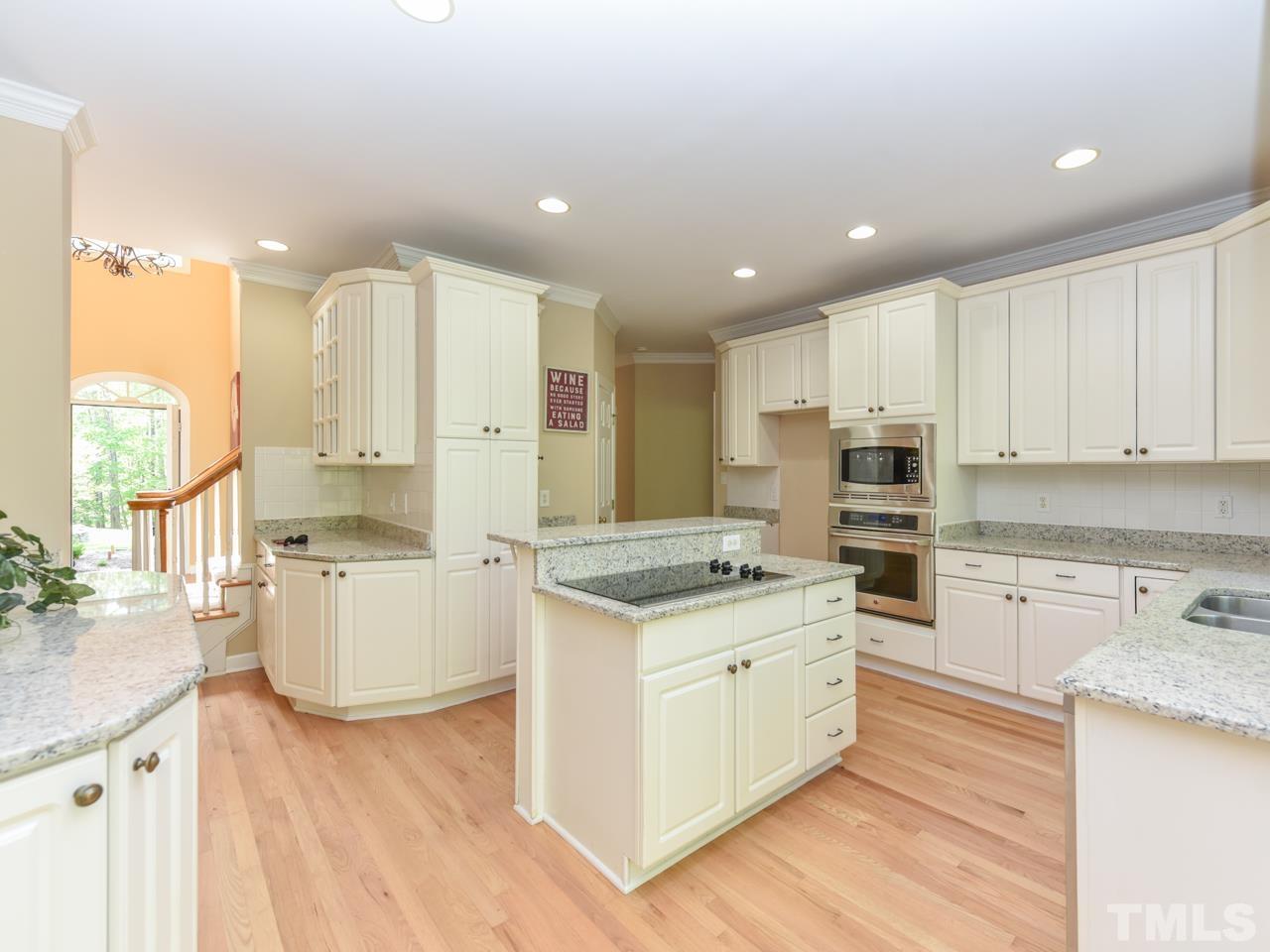 5820 Orchid Valley Road Raleigh, NC 27613 - Photo 6 of 31 a kitchen with a stove top oven and refrigerator