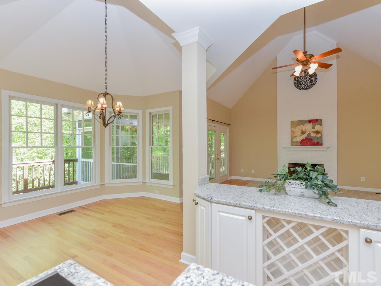 5820 Orchid Valley Road Raleigh, NC 27613 - Photo 10 of 31 a view of an entryway with chandelier and wooden floor
