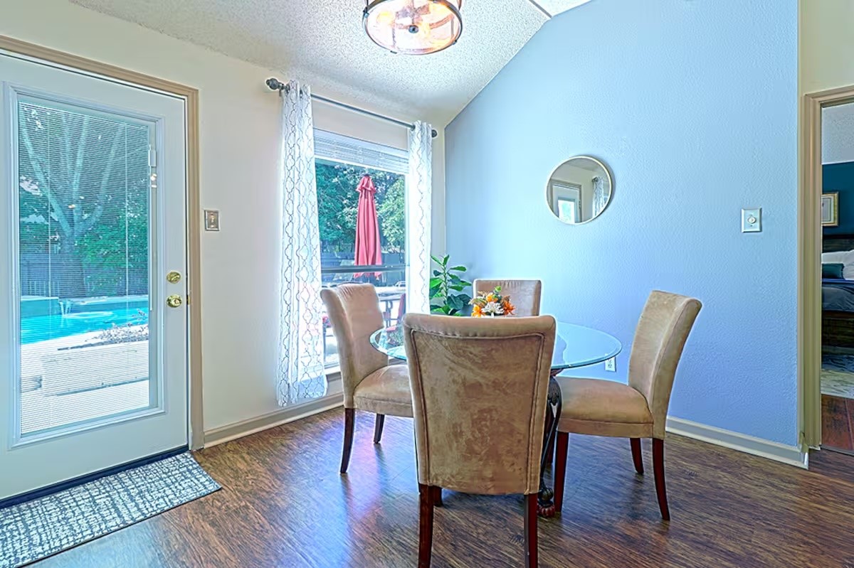 1305 Marigold Way Pflugerville, TX 78660 - Photo 11 of 22 a view of a dining room with furniture window and wooden floor