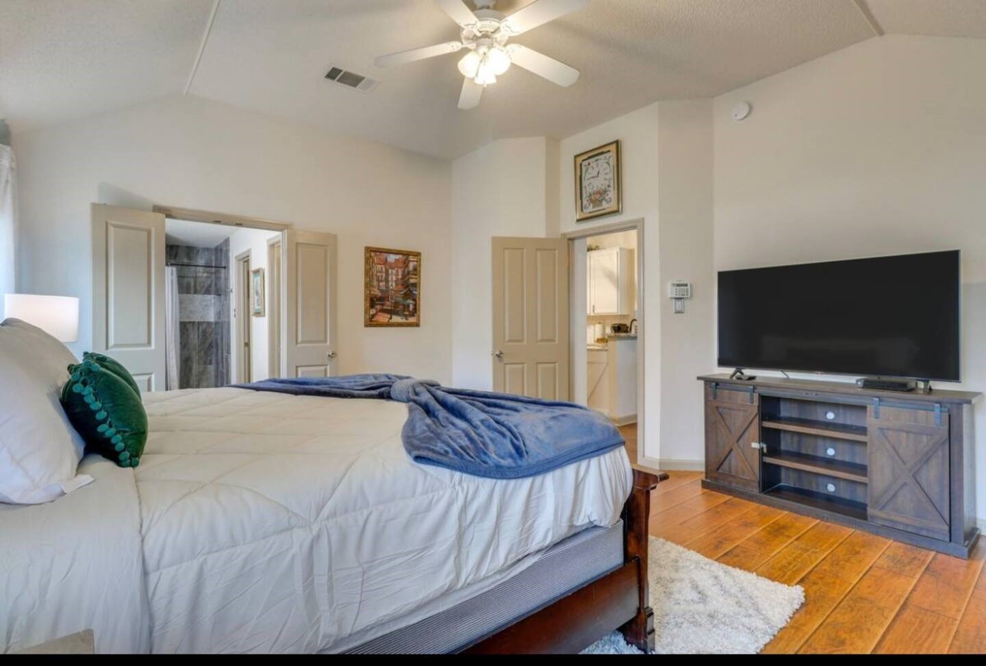 1305 Marigold Way Pflugerville, TX 78660 - Photo 14 of 22 a bedroom with a bed and a flat screen television