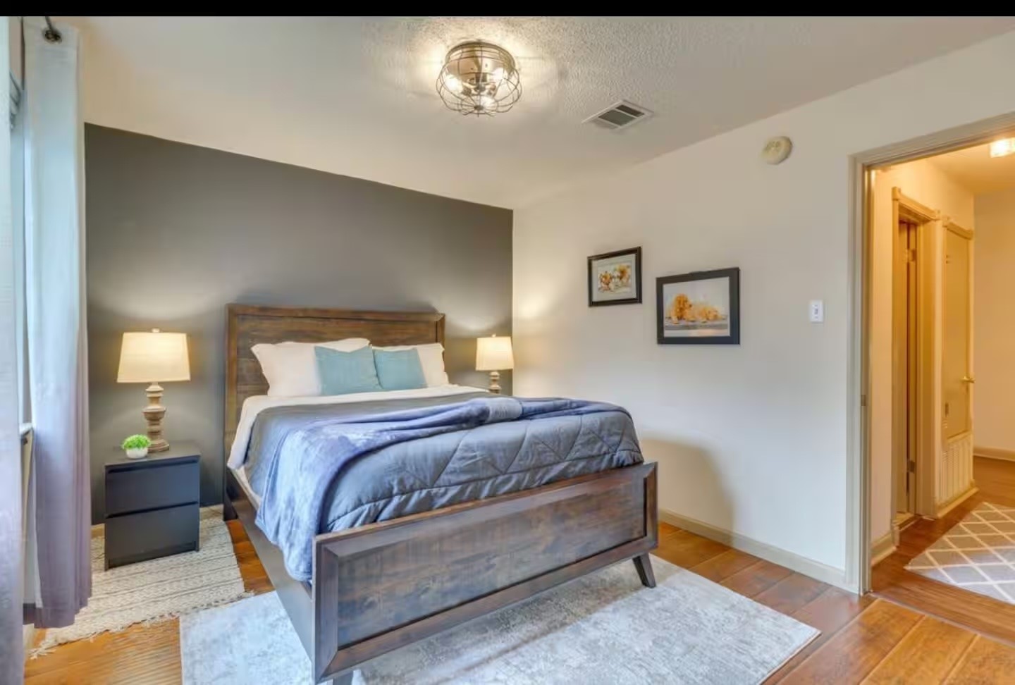 1305 Marigold Way Pflugerville, TX 78660 - Photo 15 of 22 a bedroom with a bed and a window