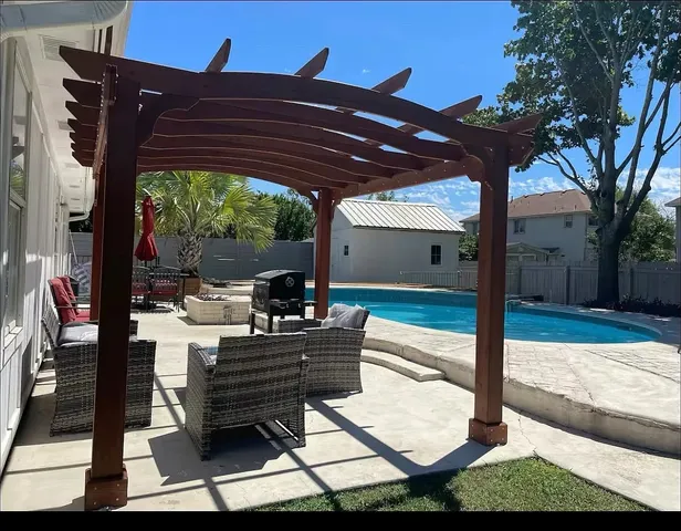 a wooden bench sitting in front of a building