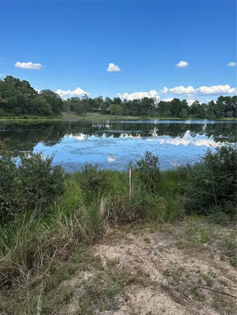 a view of a lake with a big yard